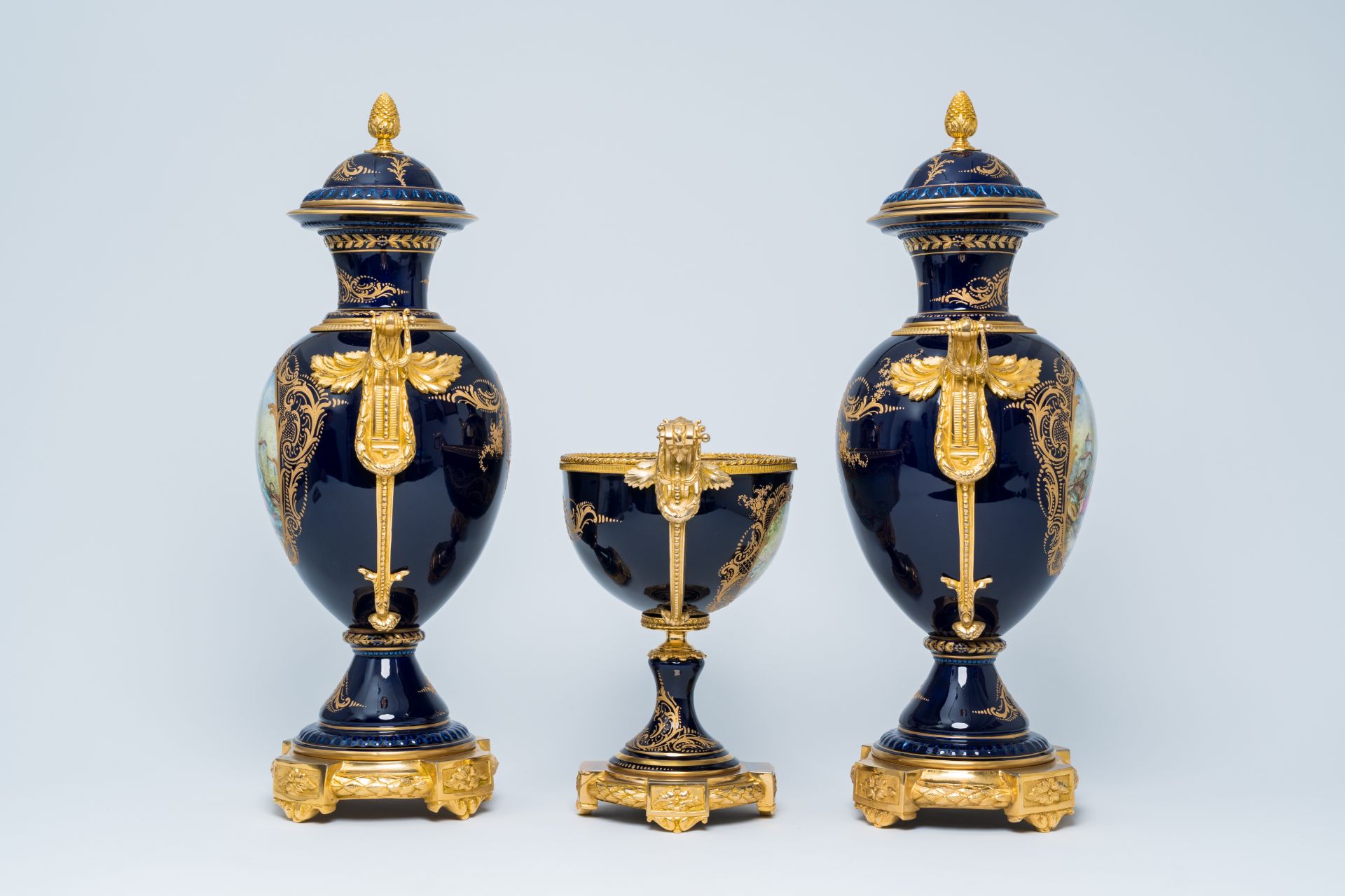 A French gilt mounted blue ground gold layered three-piece garniture with lovely scenes by Lebret, S - Image 4 of 6