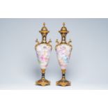 A pair of French gold layered blue ground gilt mounted vases with ladies surrounded by angels by Roc