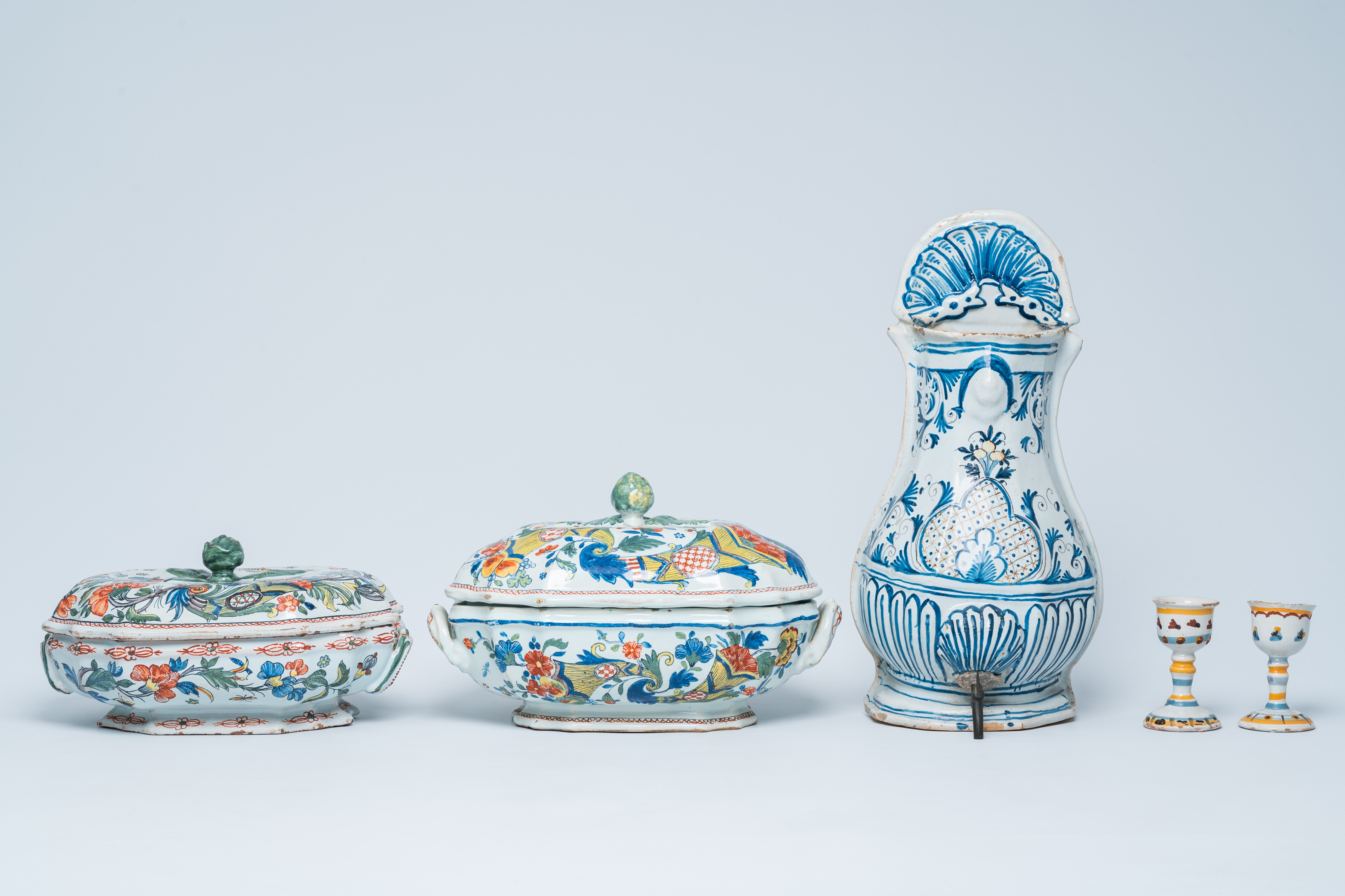Two polychrome French Rouen faience tureens and covers, a pair of egg cups and a wall fountain, 18th - Image 2 of 9