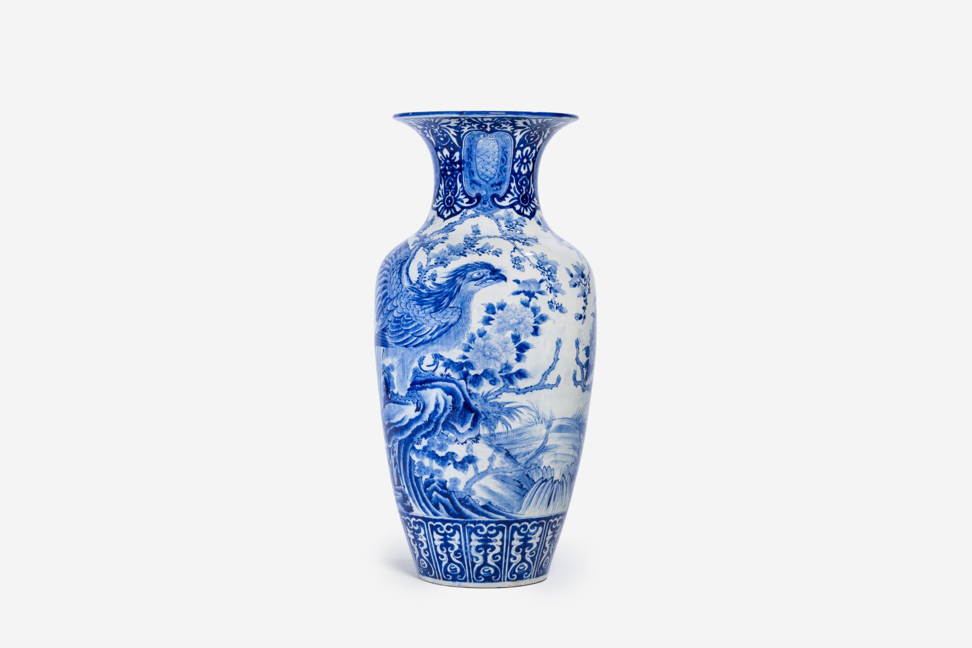 A large Japanese blue and white Arita vase with eagles among blossoming branches, Meiji, ca. 1900