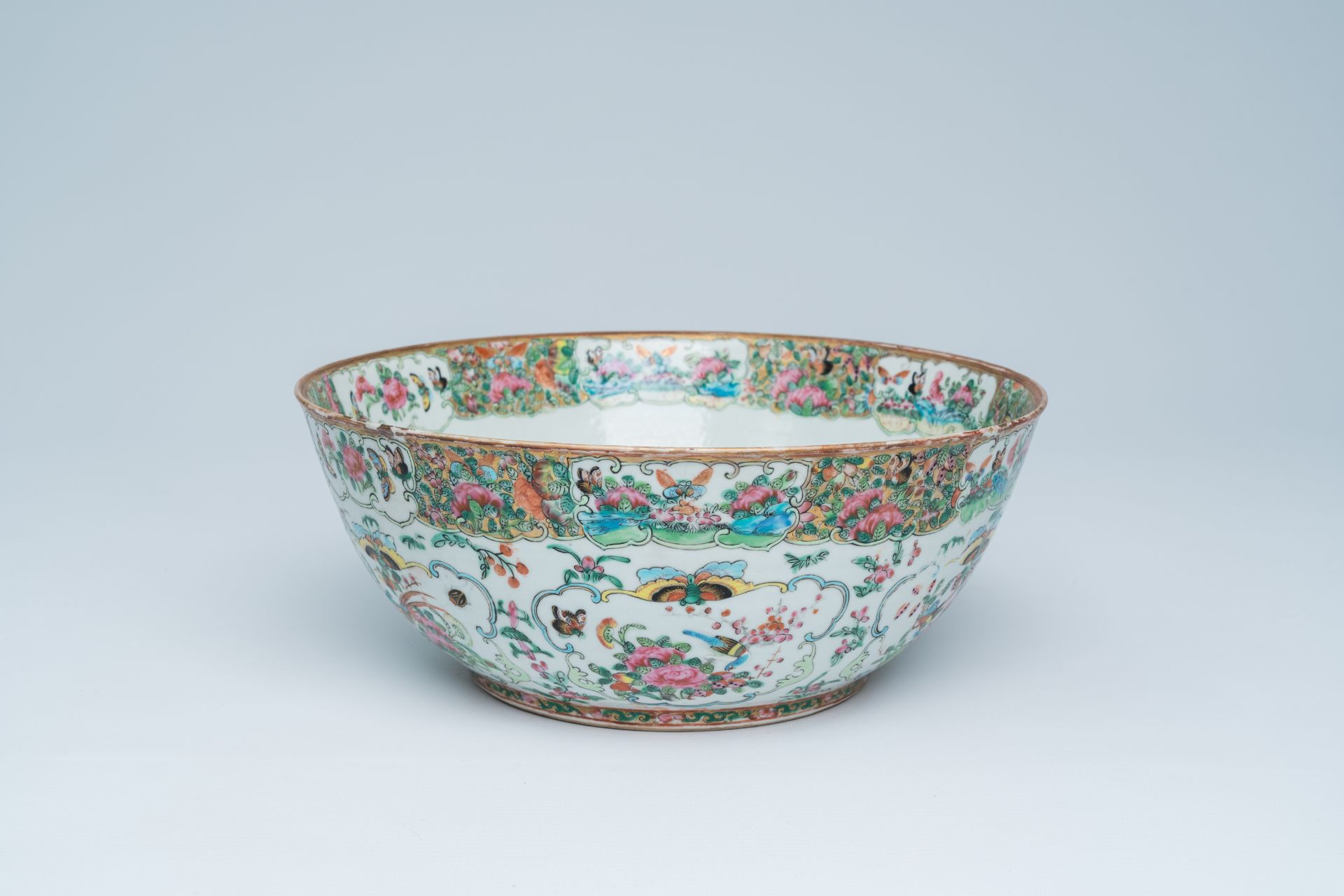 A Chinese Canton famille rose Islamic market bowl with birds and butterflies among blossoming branch