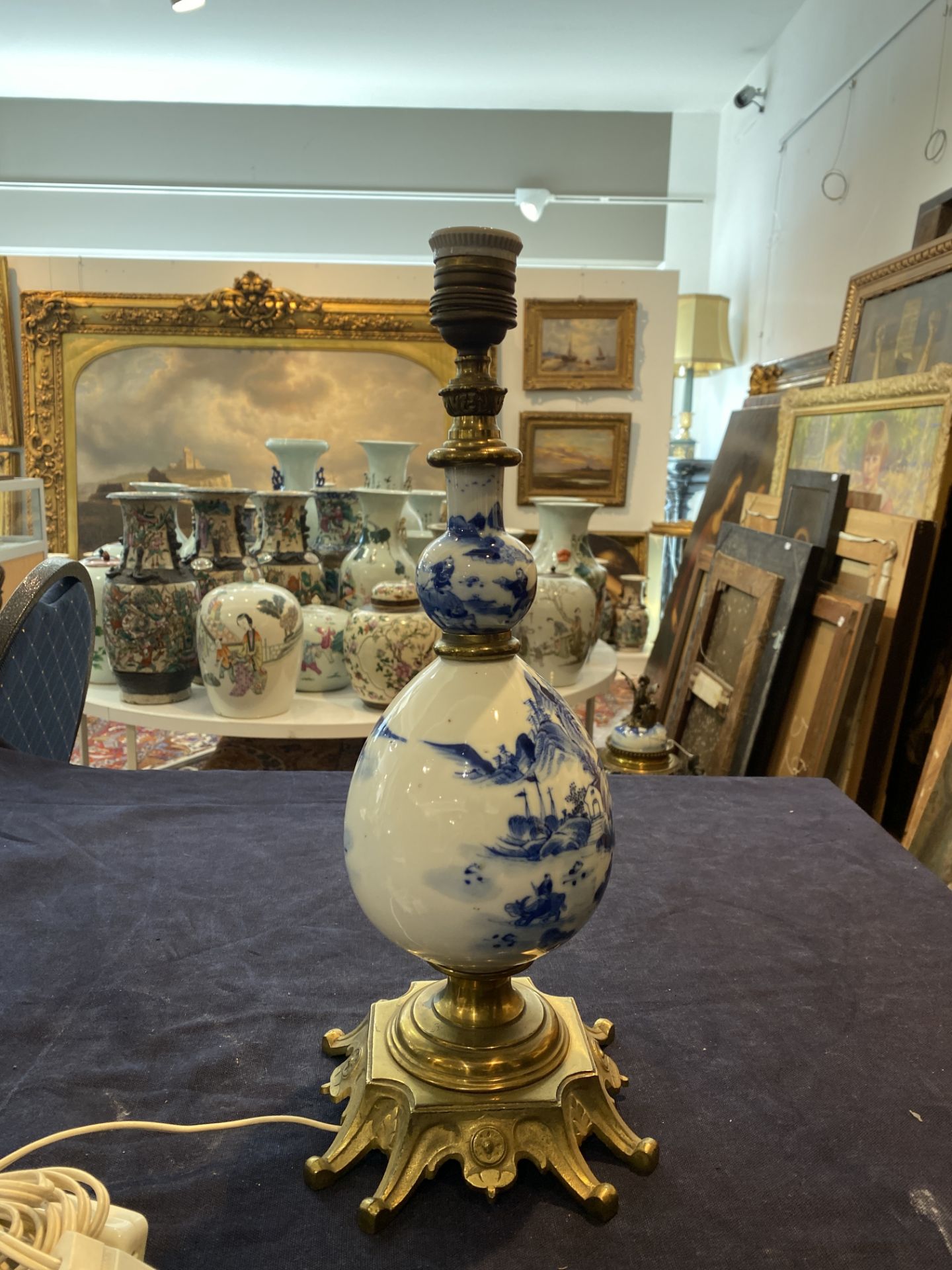 A Chinese blue and white bottle shaped vase with an animated river landscape mounted as a lamp, 19th - Image 10 of 13