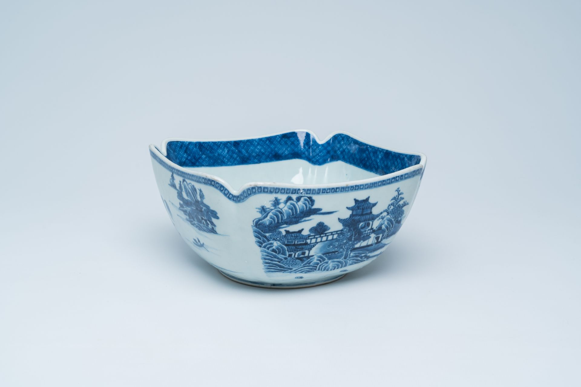 A Chinese blue and white salad bowl with an animated river landscape, 19th C.