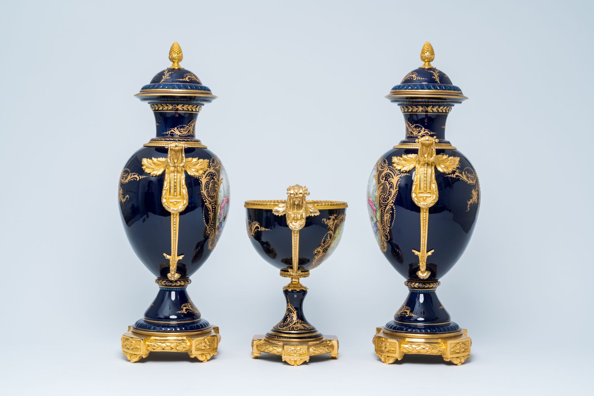 A French gilt mounted blue ground gold layered three-piece garniture with lovely scenes by Lebret, S - Image 2 of 6