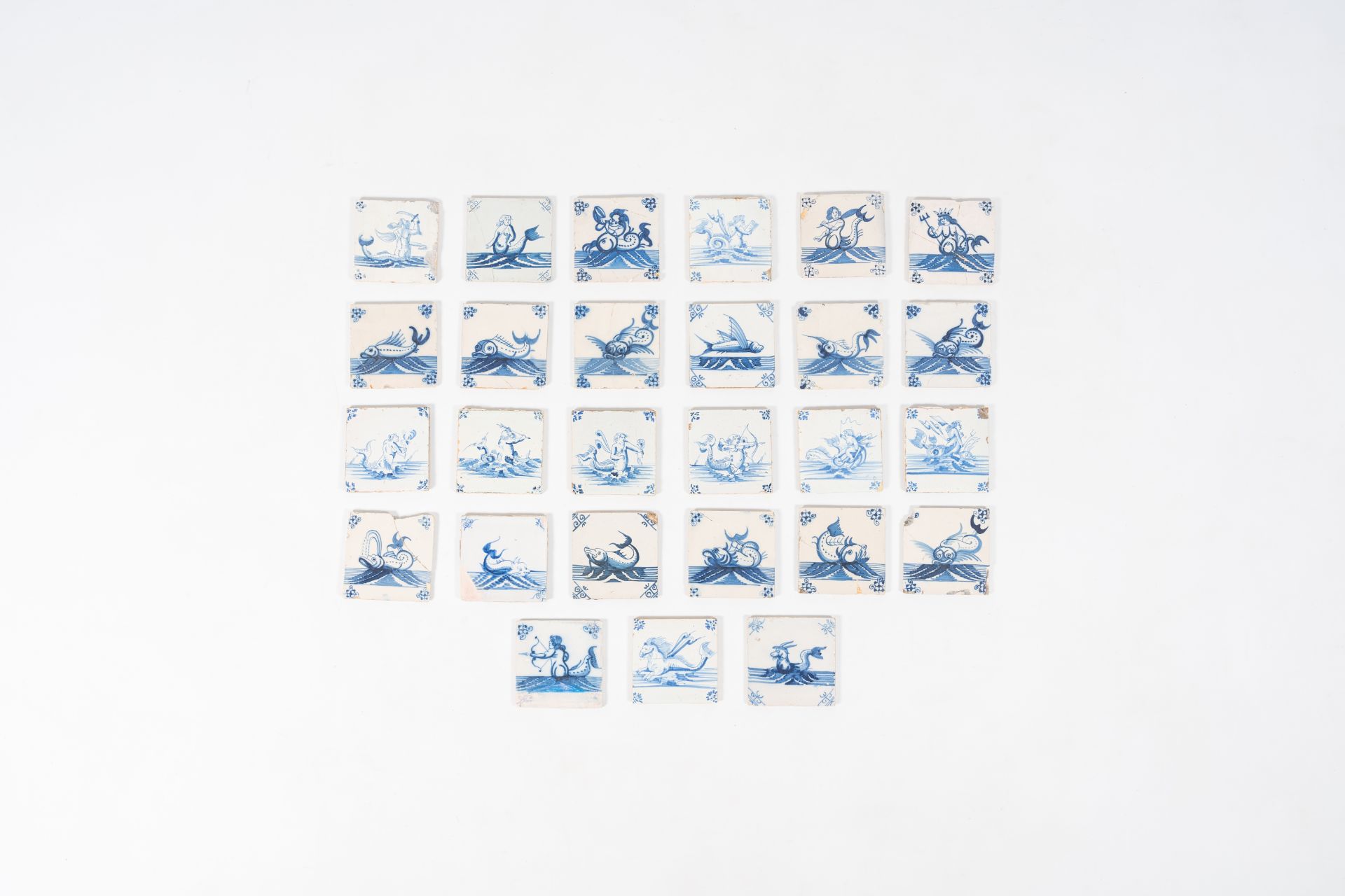 27 blue and white Dutch Delft tiles with sea monsters, 17th/19th C.