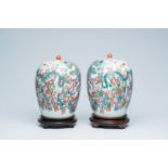 A pair of Chinese famille rose '100 boys' jars and covers, 19th C.