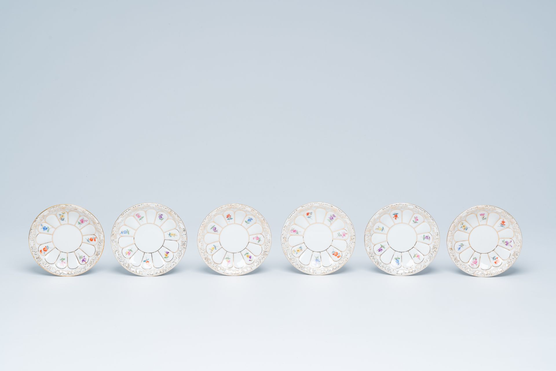 A German fifteen-piece polychrome and gilt Meissen mocha service with floral design, 20th C. - Image 3 of 10