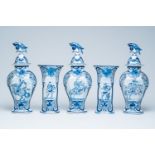 A Dutch Delft blue and white five-piece garniture with soldiers and horsemen, 19th C.