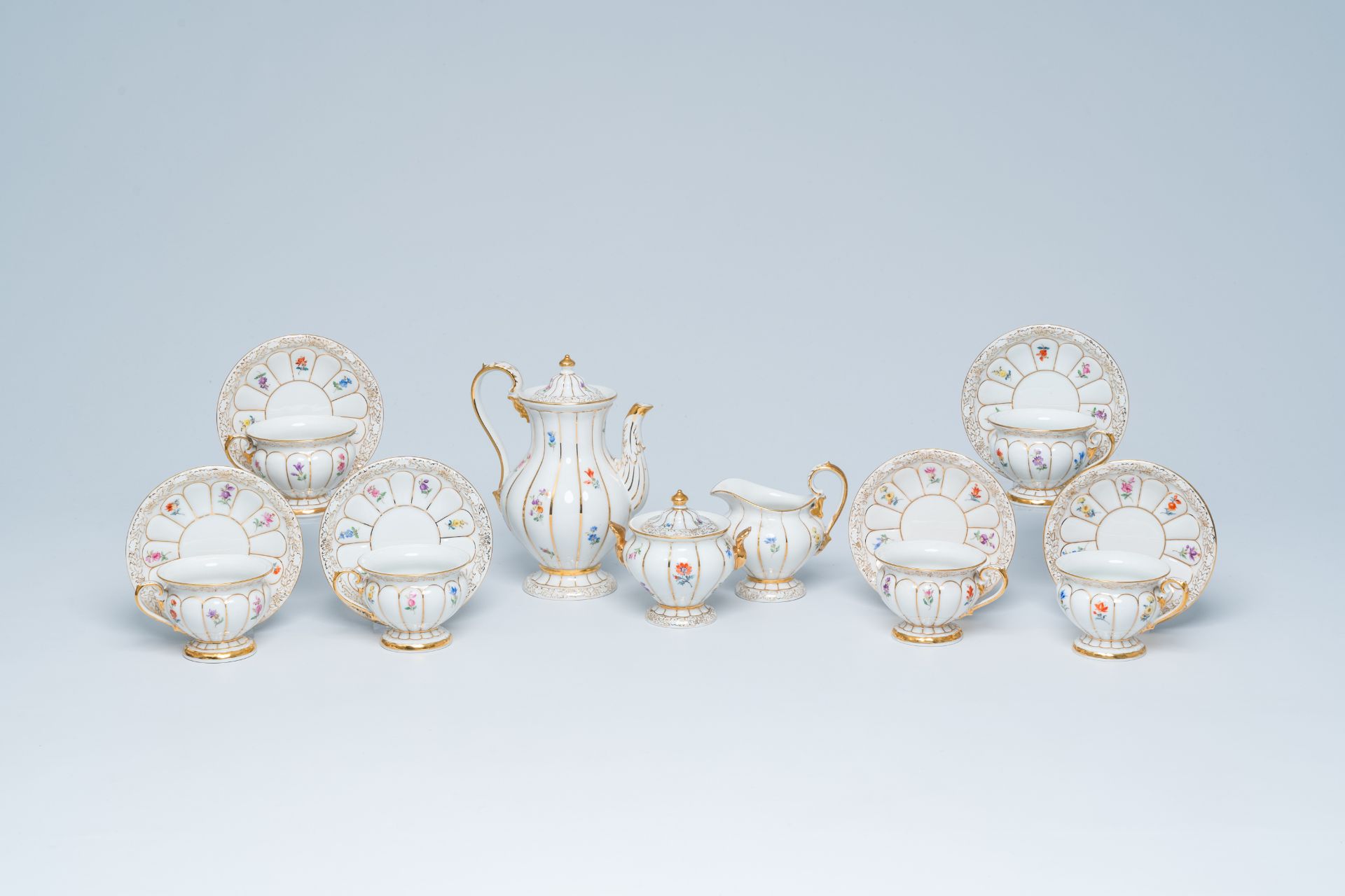 A German fifteen-piece polychrome and gilt Meissen mocha service with floral design, 20th C. - Image 2 of 10