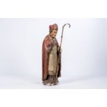 A Flemish carved and polychrome painted wood figure of a saint, 16th/17th C.