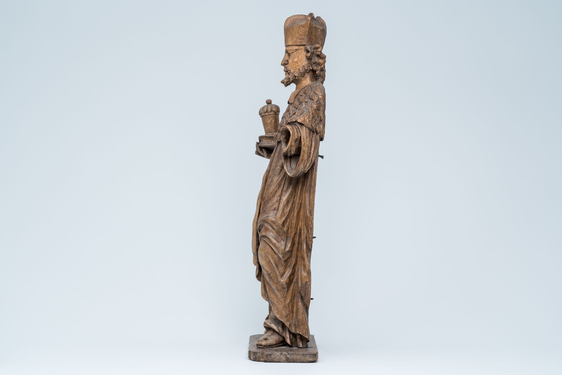 A large wood sculpture of Saint Damian holding a book and an ointment jar, Central Europe, 17th C. - Image 3 of 7
