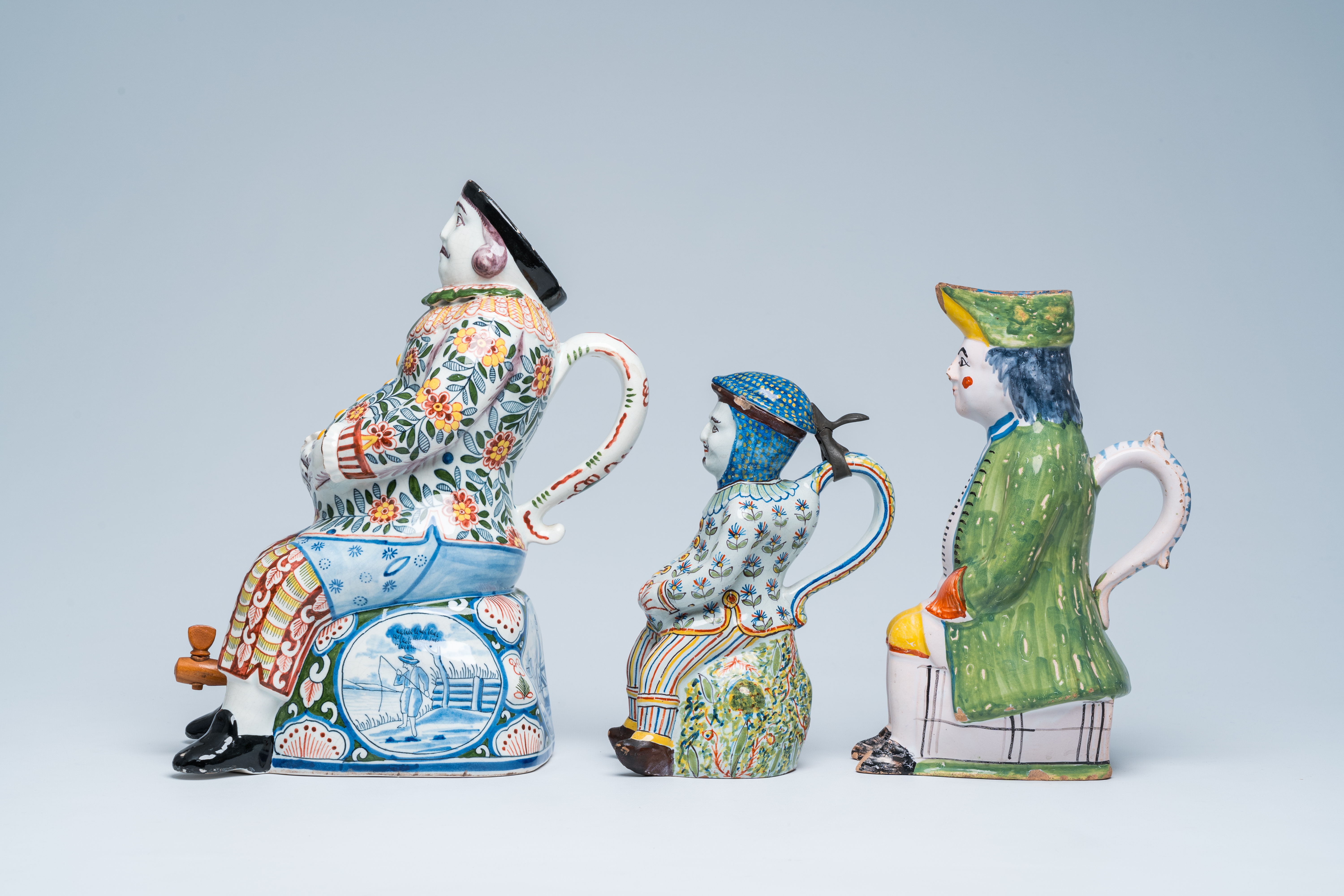 Three polychrome Delft and French faience 'bobbejak' jugs in the shape of men, 19th C. - Image 5 of 8