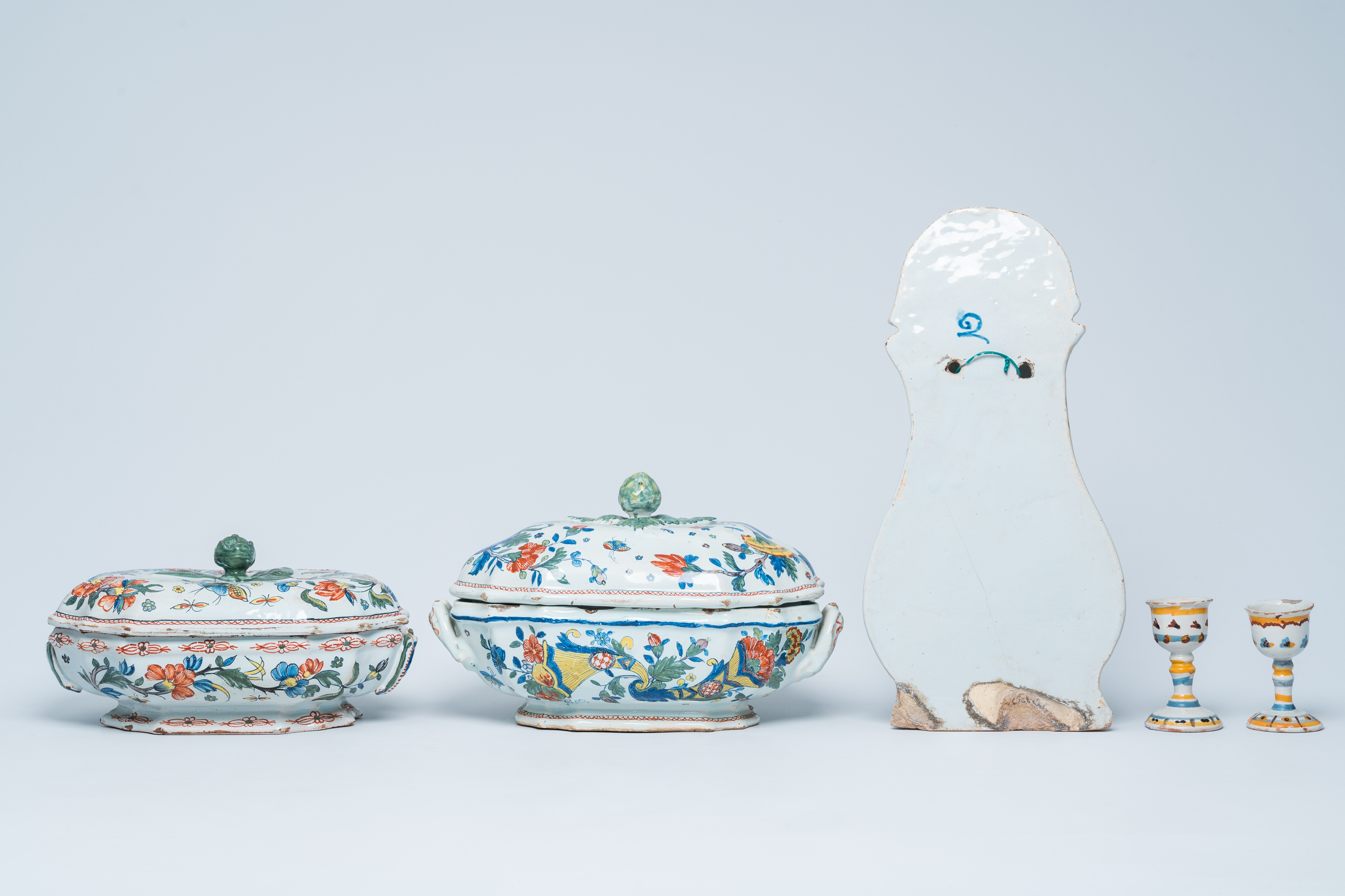 Two polychrome French Rouen faience tureens and covers, a pair of egg cups and a wall fountain, 18th - Image 3 of 9