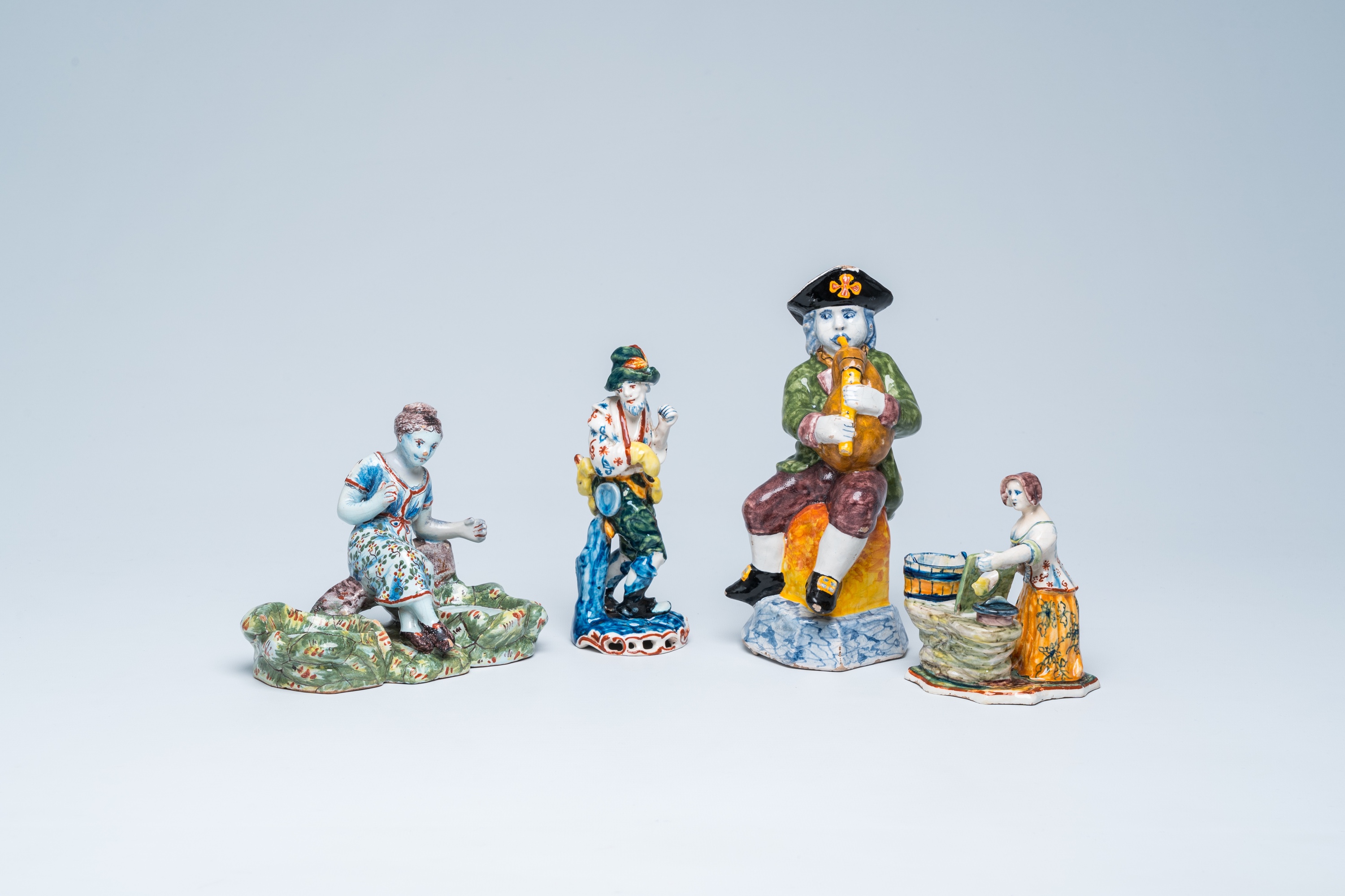 Four polychrome Dutch Delft figures, 19th C.
