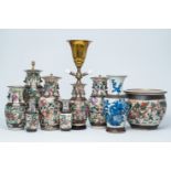 A varied collection of Chinese Nanking crackle glazed famille rose, verte, blue and white vases and