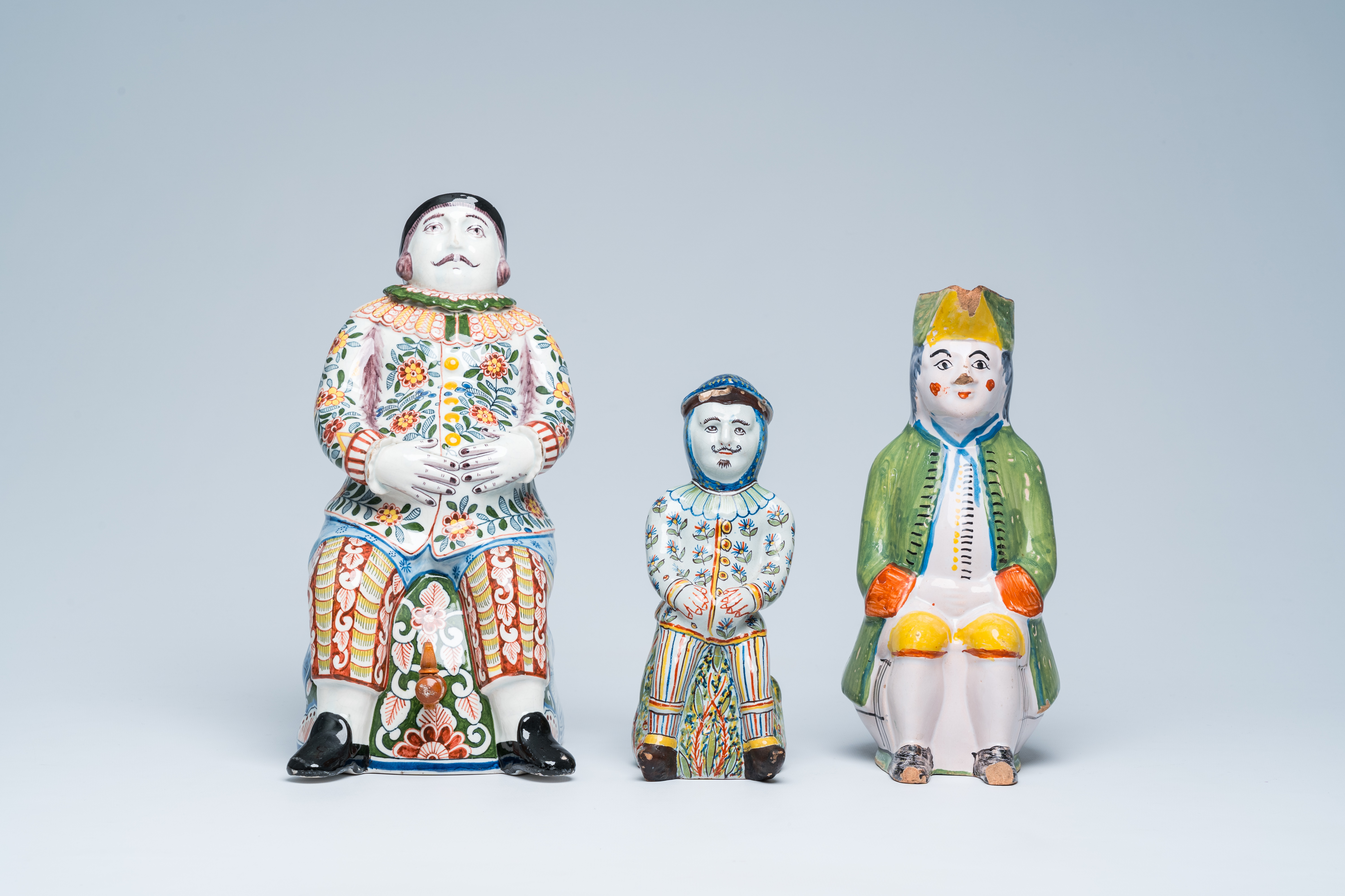 Three polychrome Delft and French faience 'bobbejak' jugs in the shape of men, 19th C. - Image 2 of 8