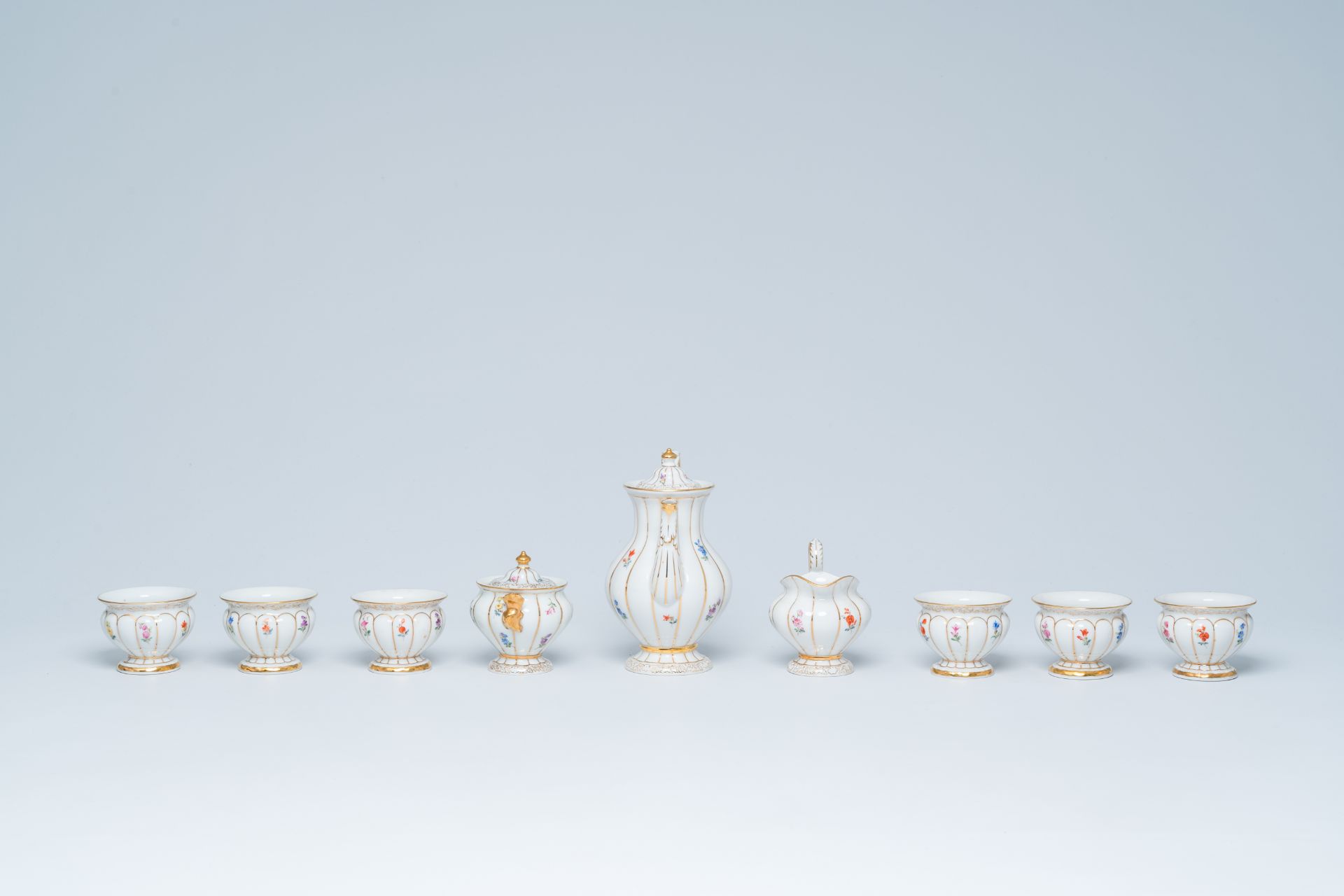 A German fifteen-piece polychrome and gilt Meissen mocha service with floral design, 20th C. - Image 8 of 10