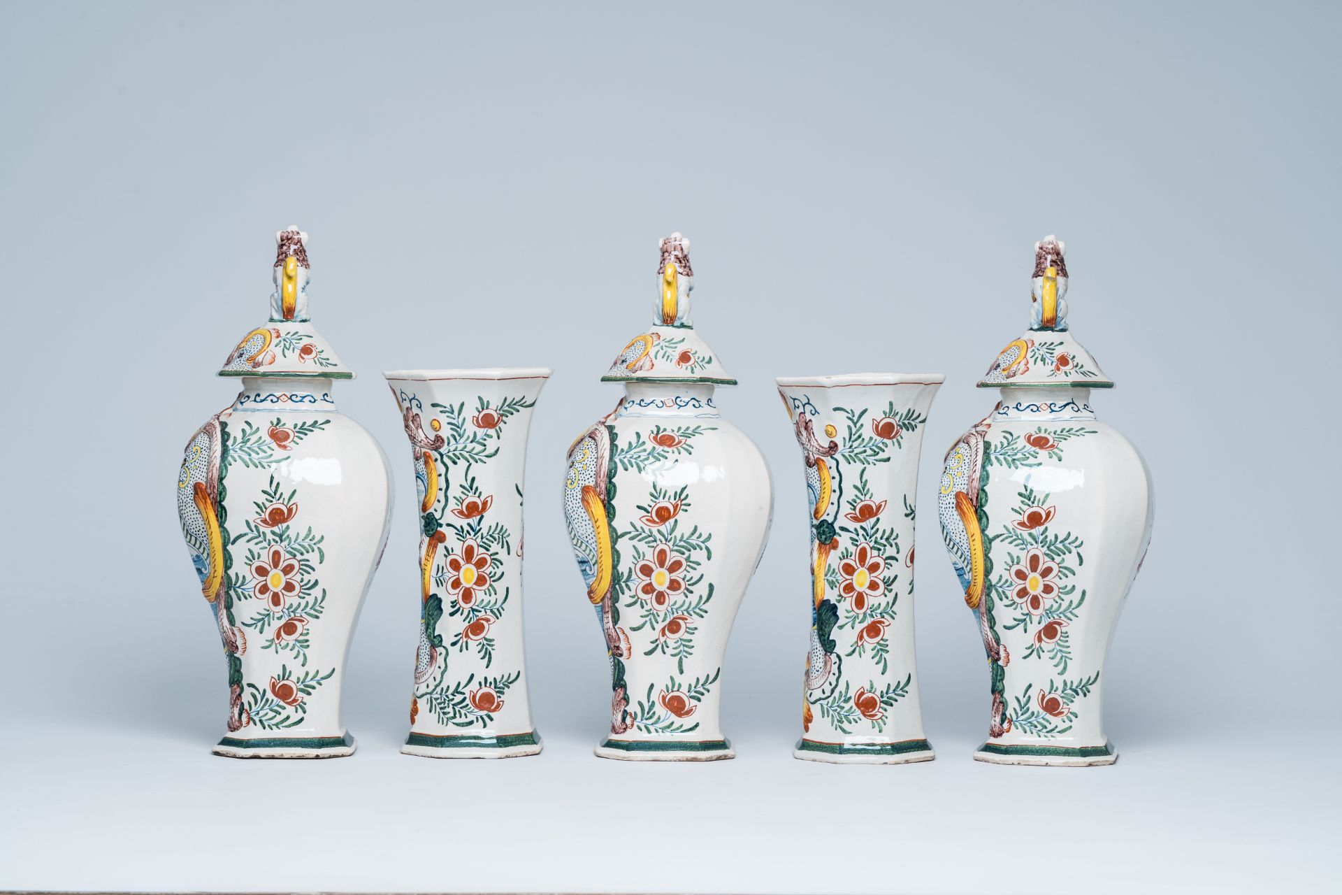 A Dutch Delft polychrome five-piece vase garniture with animated scenes, 19th C. - Image 2 of 7