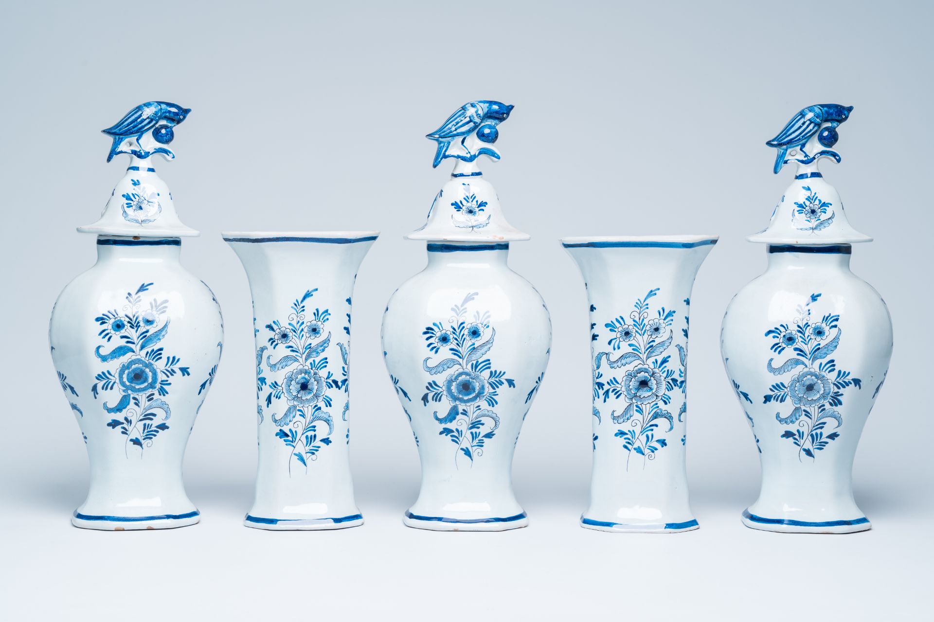A Dutch Delft blue and white five-piece garniture with soldiers and horsemen, 19th C. - Image 3 of 6