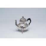 A Belgian silver Louis XV style teapot and cover with apocryphal marks, 19th C.