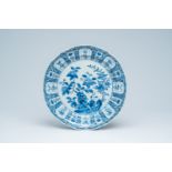 A Chinese blue and white charger with floral design, 19th C.