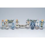 Eight blue and white and polychrome pottery holy water fonts and three flower holders, France and De