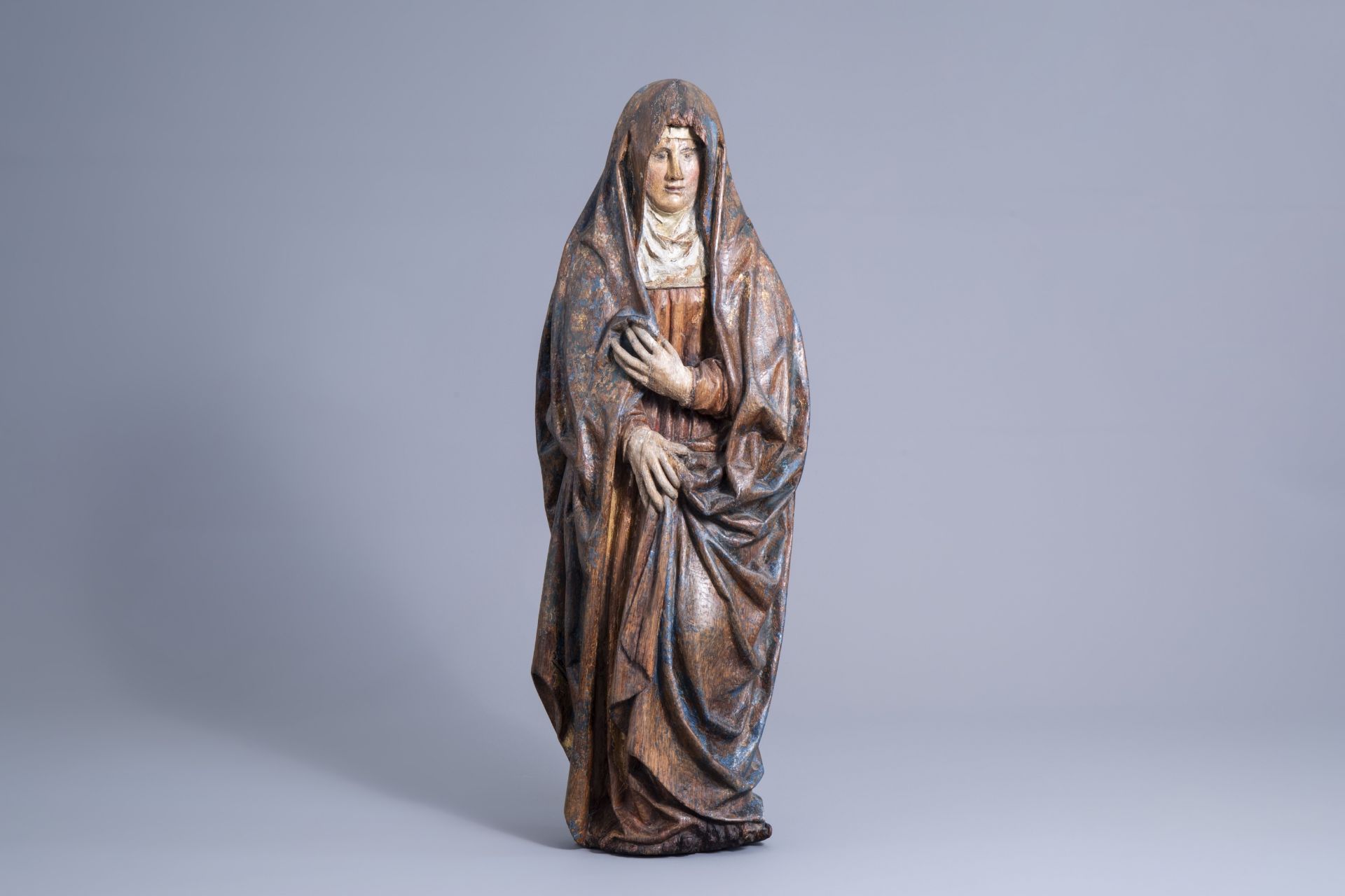 A carved and polychrome painted wooden figure of the mourning Virgin Mary, Brabant, most probably An