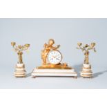 A French gilt bronze mounted white marble three-piece clock garniture with putti, 19th C.