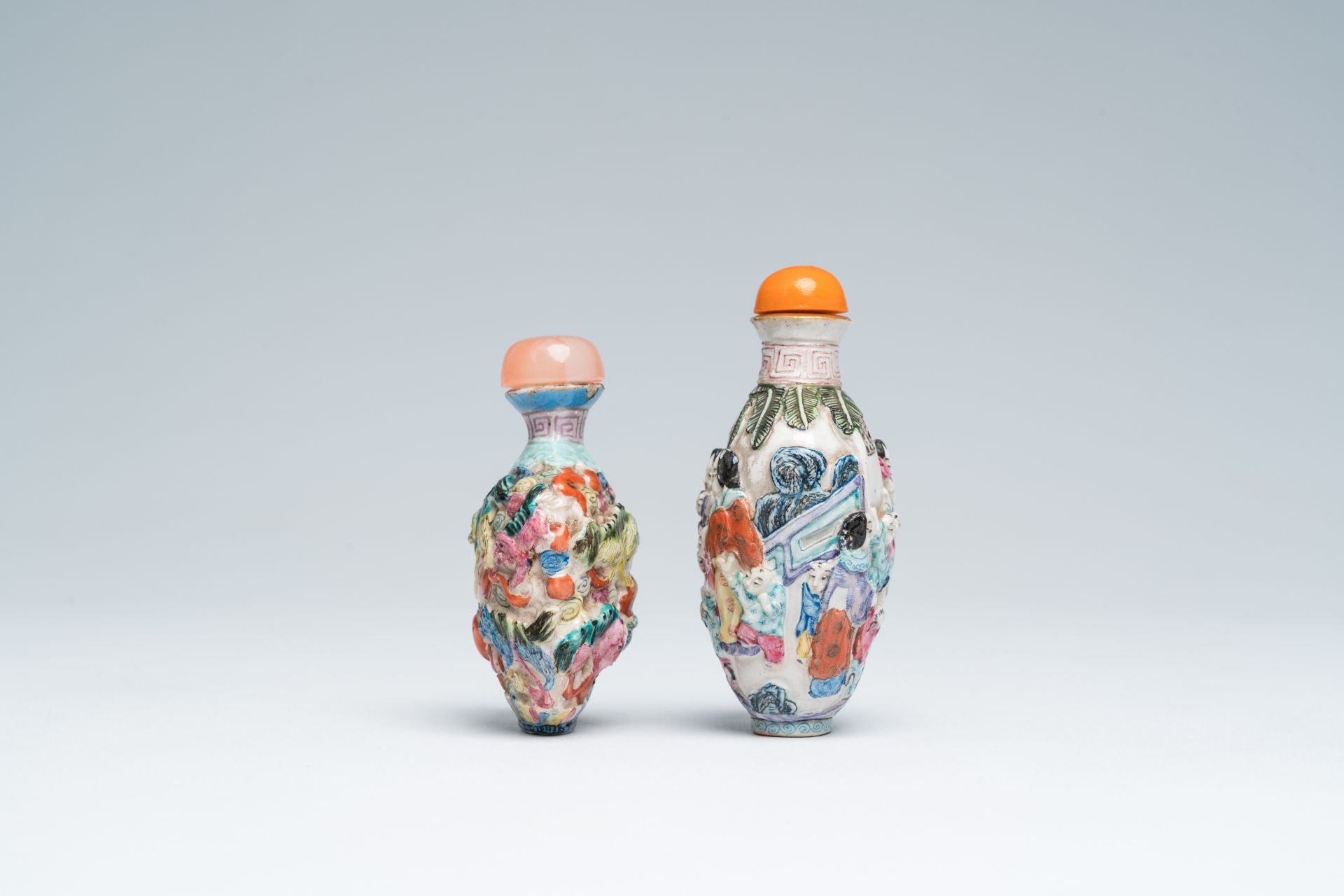Two Chinese famille rose relief-molded snuff bottles, Qianlong mark, 19th C. - Image 2 of 6