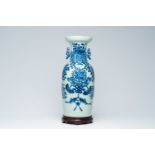 A Chinese blue and white celadon ground 'Buddhist symbols' vase, 19th C.