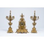 A large Belgian-French Baroque revival gilt brass three-piece clock garniture, late 19th C.