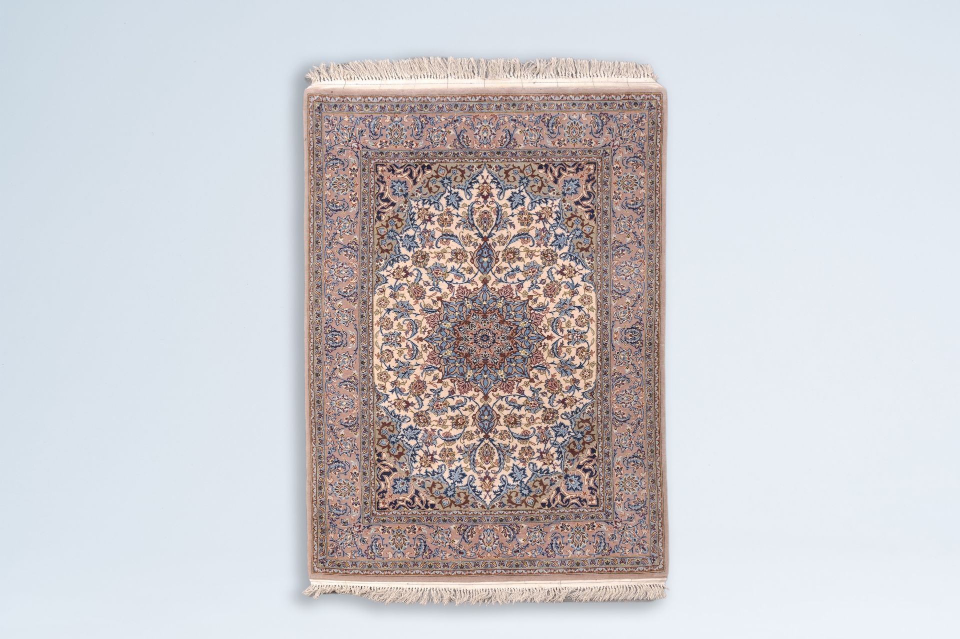 A Persian Isfahan rug with floral design, wool on cotton, Iran, 20th C.
