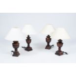 Four baluster shaped patinated wood table lamps, 20th C.