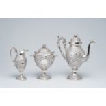 A three-piece American silver lush relief decorated coffee set, maker's mark Andrew Ellicott Warner,