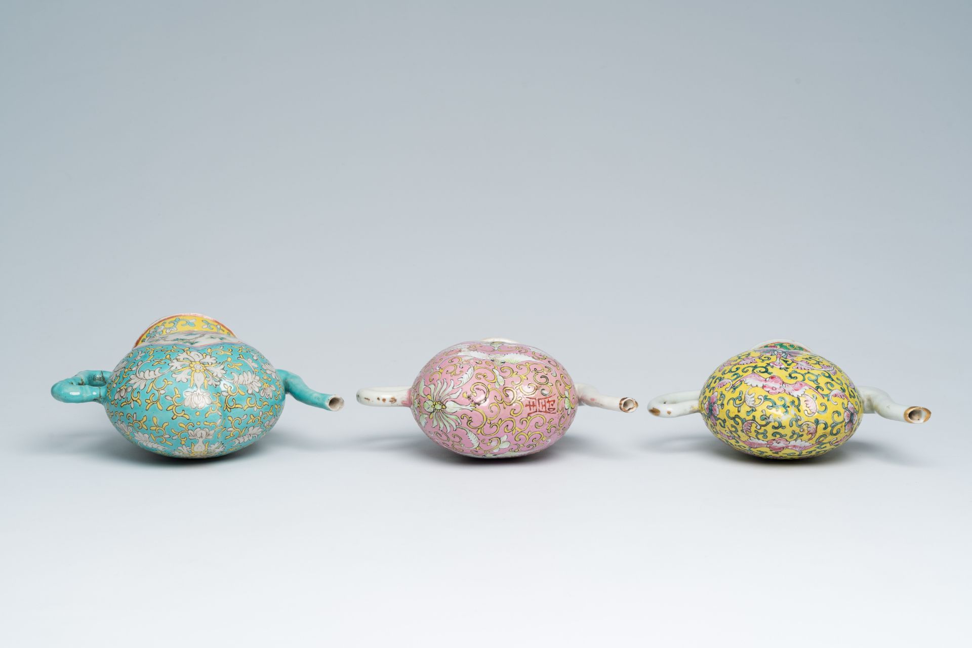 Three Chinese famille rose peach-shaped cadogan teapots with floral design, 19th C. - Image 6 of 7