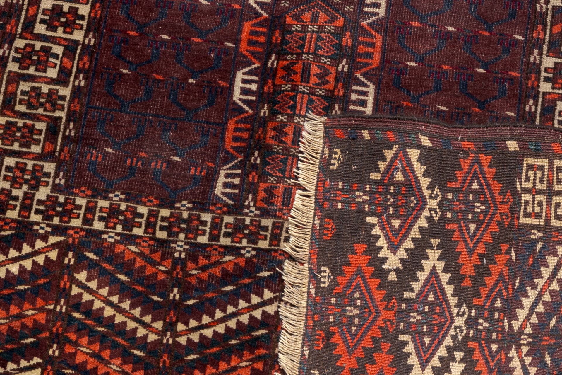 Two Turkmen prayer rugs with stylized motifs and a Persian Khamseh rug, wool on cotton, first half 2 - Image 3 of 5