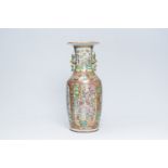 A large Chinese Canton famille rose vase with palace scenes and floral design, 19th C.