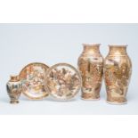 Three Japanese Satsuma vases and two chargers with landscapes, playing children and Immortals, Meiji