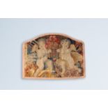 A fragment of a French wall tapestry with two angels and trophies, ca. 1700