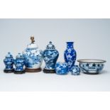 A varied collection of Chinese blue and white porcelain with floral design, a landscape and prunus o