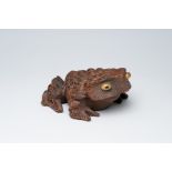 A Japanese cryptomeria wood okimono of a toad, possibly Akita prefecture, second half 20th C.