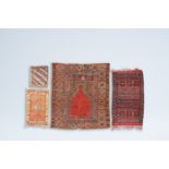 Four various Oriental rugs with geometric designs, wool on cotton, 20th C.