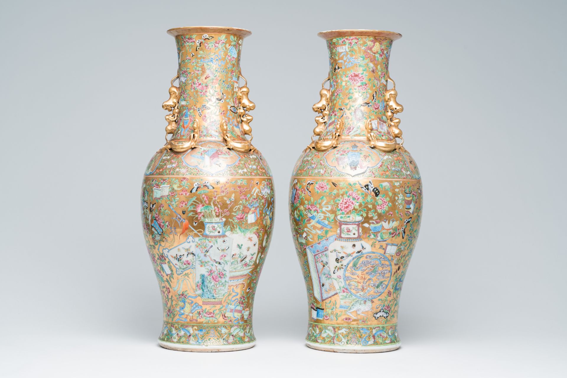 A pair of Chinese Canton famille rose gold ground vases with birds and butterflies among blossoming - Image 3 of 6