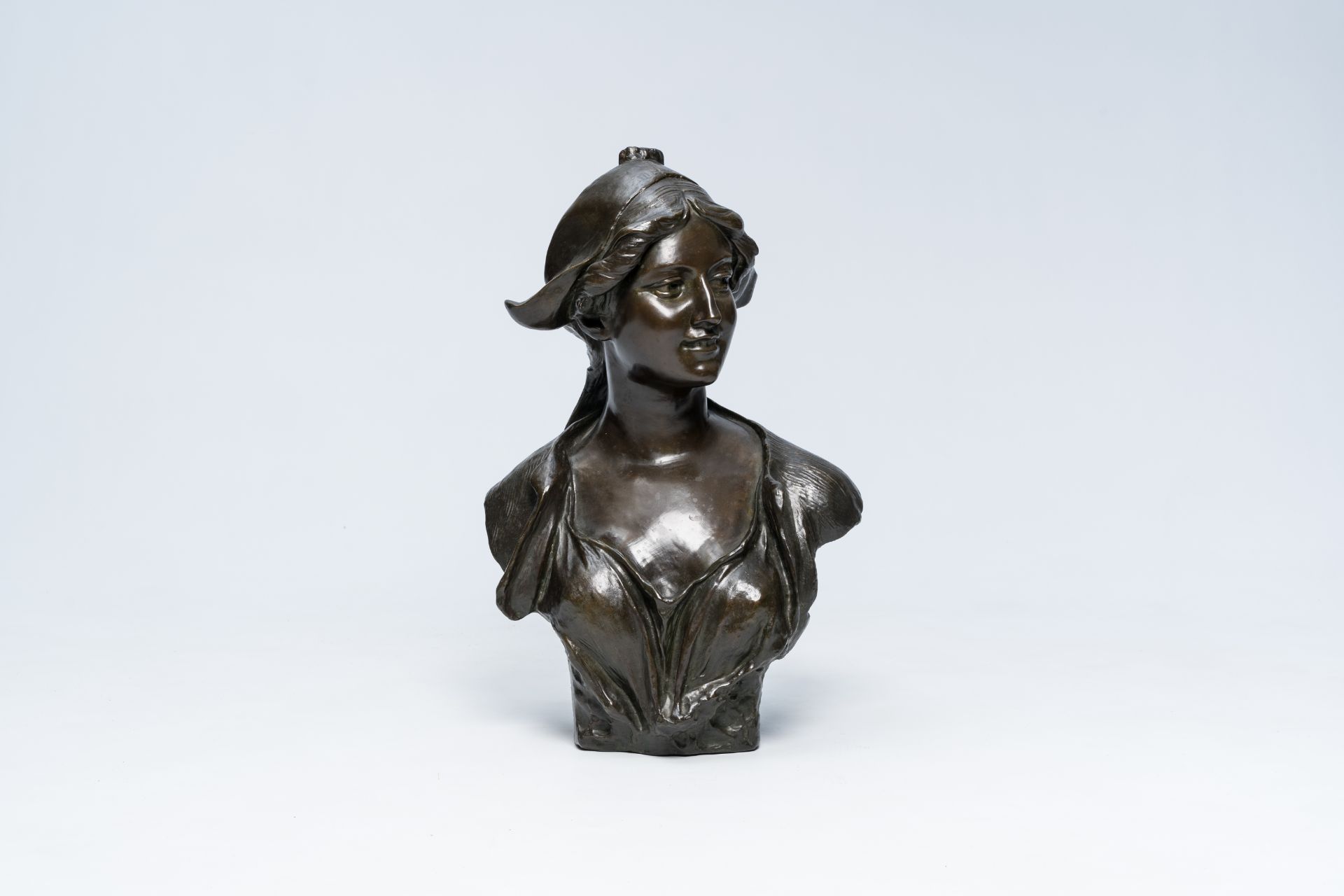 Jef Lambeaux (1852-1908): Bust of a young lady with a headdress, brown patinated bronze