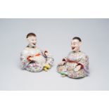 A pair of German polychrome decorated porcelain nodding-head mandarin figures, 20th C.
