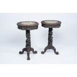 A pair of Chinese wooden side tables with round Canton famille verte plaques, 19th C.