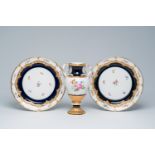 A pair of German polychrome and gilt Meissen plates with floral design and a vase with snake-shaped