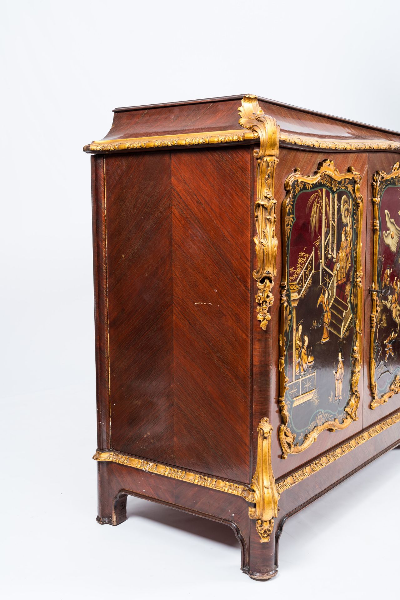 A French gilt wood and mahogany veneered four-door sideboard with oriental style lacquer, 20th C. - Image 6 of 10