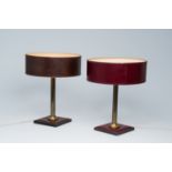 A pair of French brass and leather clad desk lamps after a design by Jacques Adnet, third quarter 20