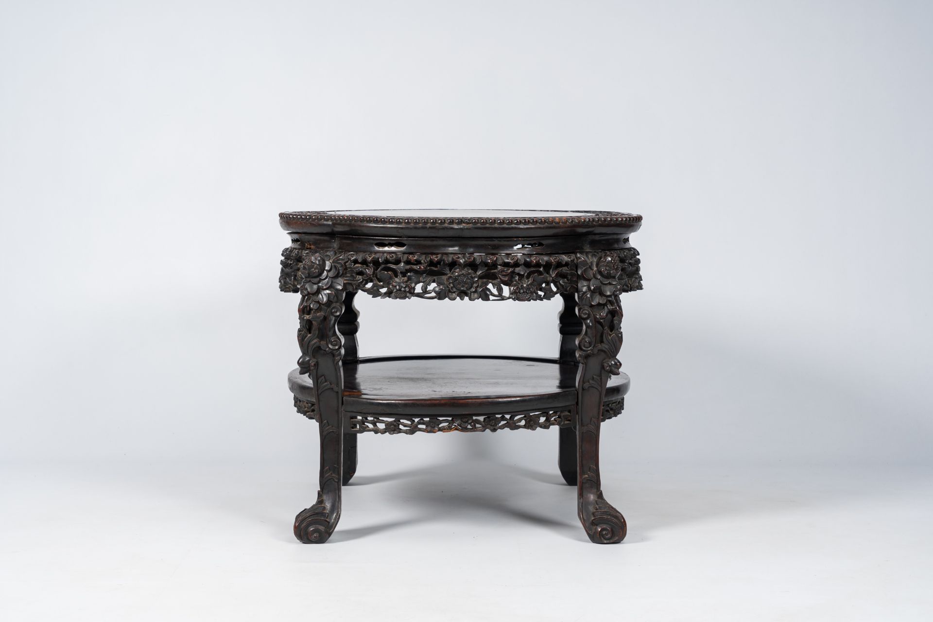 A Chinese richly carved hardwood table, 19th C. - Image 4 of 7